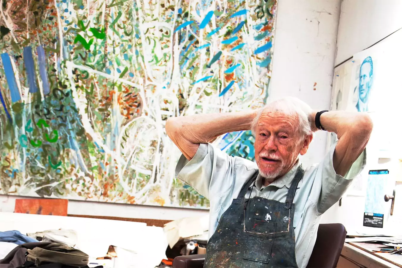 Happy elderly man in art class