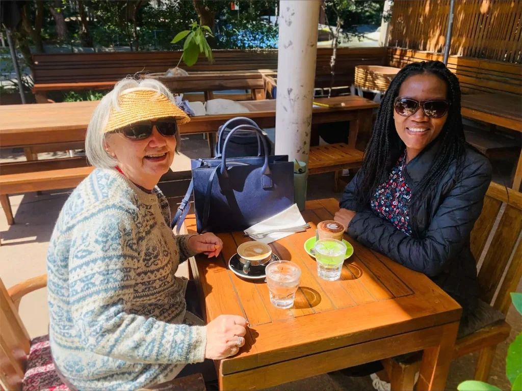 Personalised support: Two women sitting at a café having coffee